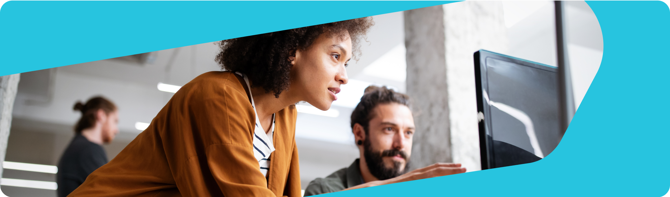 Banner image of two people looking at a laptop